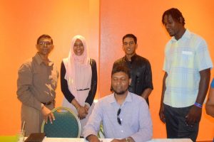 Habeeb Alli (seated), flanked by (from left) Petamber Persaud and poets Salimah Hussain, Zaheer Zamaluddin and Jamie Meyers