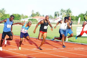Silver medalist at the 2014 Central American and Caribbean Games, 21 year-old Levi Cadogan (lane 6) upsets Kim Collins (lane 5) to take the spoils in the marquee 100m event in a close finish. (Orlando Charles photo)