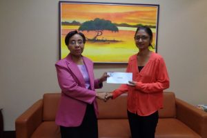 GBTI’s Head of Banking Operations, Collette Lyken-Ramdial (left) handing over the donation to Dr Bibi Alladin-Karan of the New-Born Screening project 