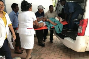 Delroy Henry being placed in the ambulance for transfer to Suddie Hospital
