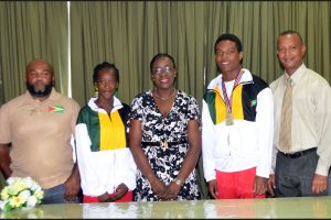  Minister of Education, Nicolette Henry poses for a photo opportunity with Guyana’s representatives at the just-concluded World U-18 Youth Championships, in Nairobi, Kenya, Chantoba Bright and Daniel Williams. Also pictured is the duo’s coach, Johnny Gravesande and President of the AAG, Aubrey Hutson.