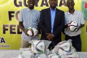 GFF President Wayne Forde (centre) with  GFC Team Manager Jafar Gibbons (left) and Pele FC Vice President Alexander Best.