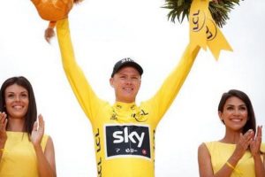 Team Sky rider and yellow jersey Chris Froome of Britain celebrates his overall win on the podium. Reuters/Benoit Tessier