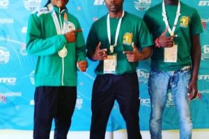 Guyana’s silver medalist at the Commonwealth Youth Championships, Keevin Allicock (left) flanked by coach, Seibert Blake and Guyana’s other representative in the fistic sport, Christopher Moore. Moore lost in the semifinals. 