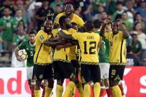 The Jamaicans celebrate the opening goal scored by Kemar Lawrence.

