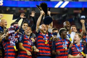 United States midfielder Michael Bradley (5) hoists the trophy as he celebrates with teammates after defeating Jamaica in the CONCACAF Gold Cup final (Mark J. Rebilas-USA TODAY Sports)