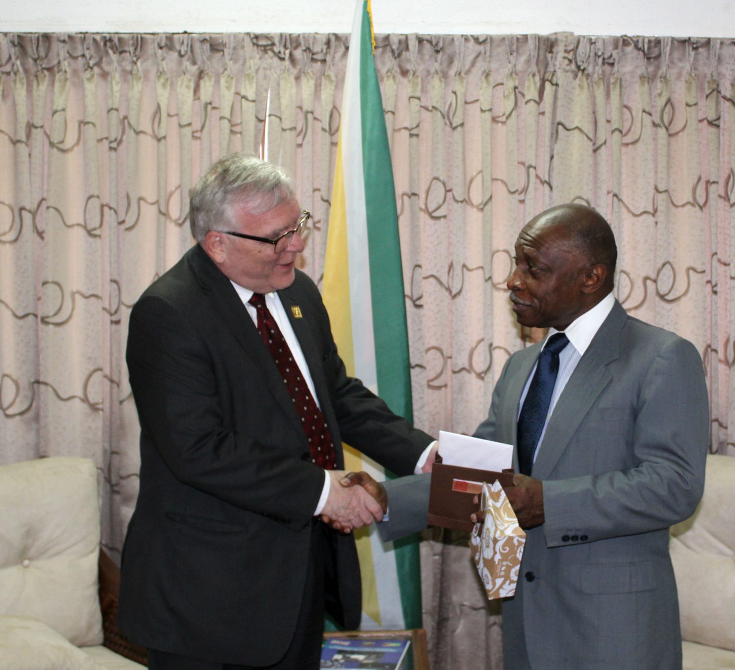 Minister of Foreign Affairs Carl Greenidge (right) and outgoing High Commissioner Pierre Giroux during the courtesy call.