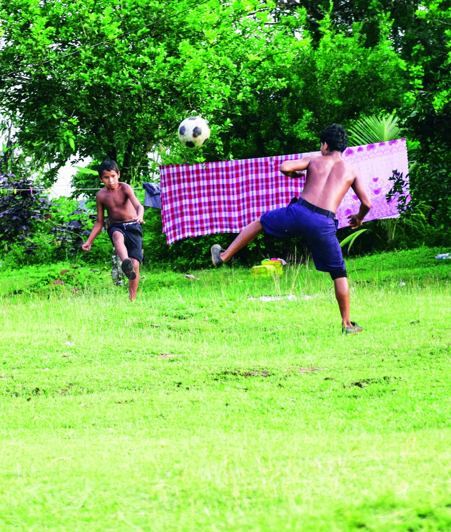 Game on:  Intense backyard football at Mabaruma! (Photo by Mariah Lall)