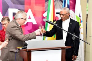 President David Granger (right) and Canada’s High Commissioner to Guyana,  Pierre Giroux sharing a toast at the reception to commemorate the 150th Anniversary of the Canada Confederation. (Ministry of the Presidency photo)
