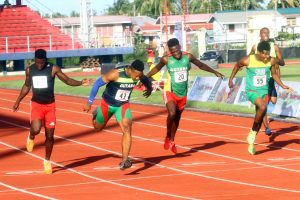 Photo Finish! Compton Caesar leans in ahead of Emmanuel Archibald and Daniel Williams to take the crown of National 200m sprint champion. (Orlando Charles photo)