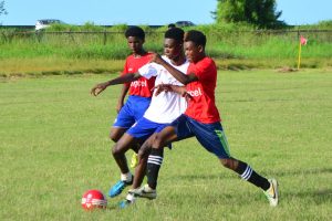 Scenes from the Tutorial High and North Georgetown clash in the Digicel Schools Football Championship at the Ministry of Education ground yesterday.