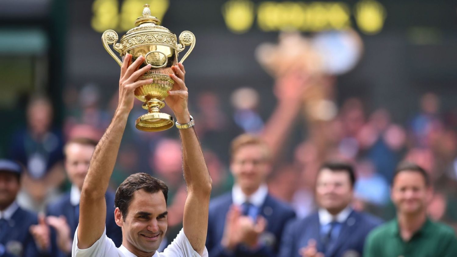 Switzerland’s Roger Federer holds the winner’s trophy after beating Croatia’s Marin Cilic in their men’s singles final match, during the presentation on the last day of the 2017 Wimbledon Championships at The All England Lawn Tennis Club in Wimbledon, southwest London, on July 16, 2017.
Roger Federer won 6-3, 6-1, 6-4.
 / AFP PHOTO / Glyn KIRK / RESTRICTED TO EDITORIAL USE        (Photo credit should read GLYN KIRK/AFP/Getty Images)