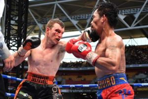 Jeff Horn of Australia punches Manny Pacquiao of the Philippines during the title fight yesterday. AAP/Dave Hunt/via REUTERS