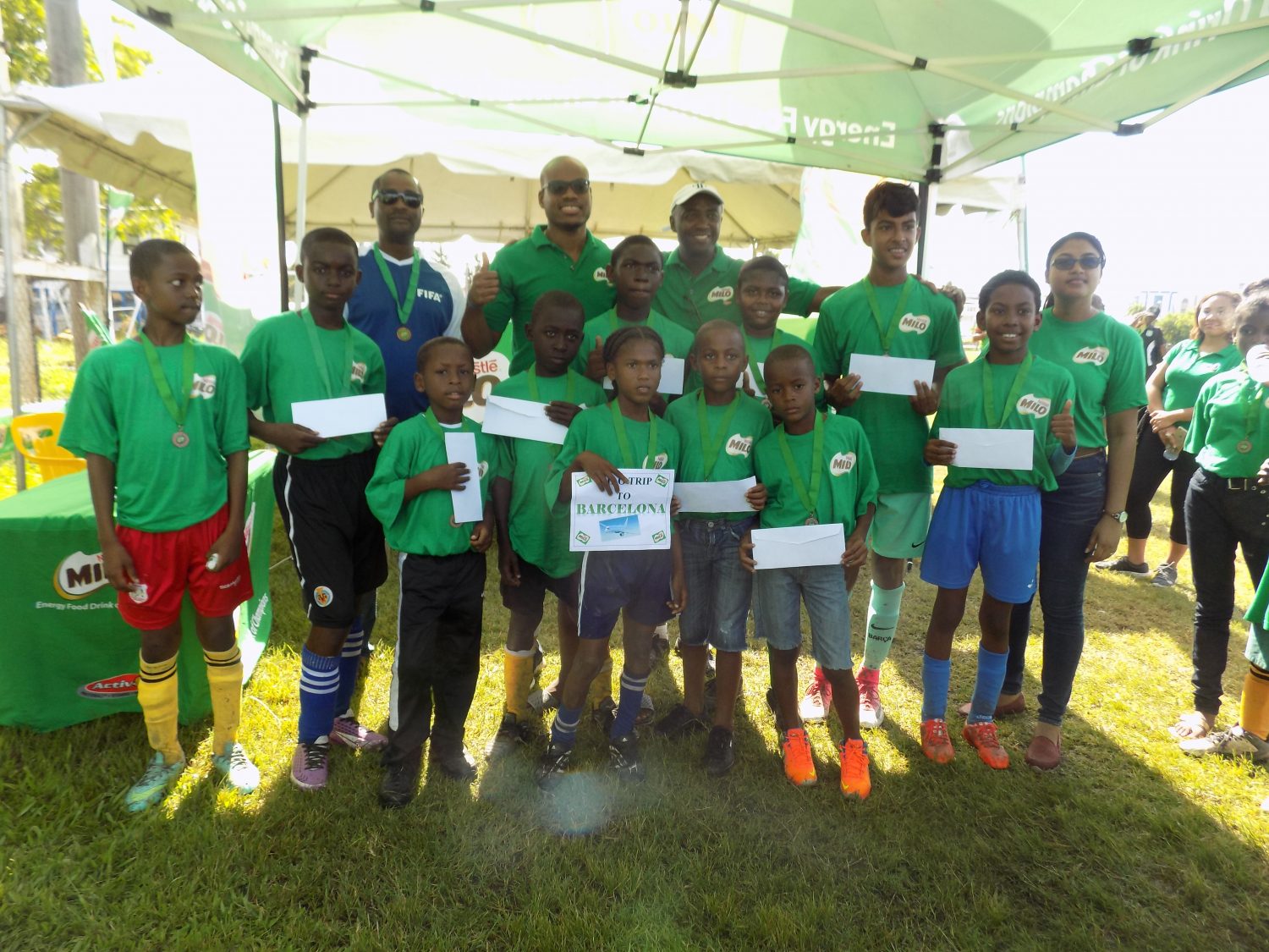 Nestle Milo/FC Barcelona Football Skills Tournament winner Martin King (centre) posing with the other top 10 finishers following the conclusion of the event. Also in the picture are representatives from Nestle Milo and GFF President Wayne Forde. 