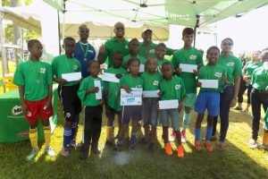Nestle Milo/FC Barcelona Football Skills Tournament winner Martin King (centre) posing with the other top 10 finishers following the conclusion of the event. Also in the picture are representatives from Nestle Milo and GFF President Wayne Forde. 