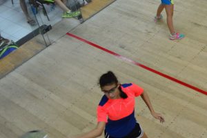 Taylor Fernandes (left) unleashing a forehand against Madeleine Rose of OEC during their Girls u19 fixture at the Georgetown Club Facility on the opening day of the Junior Caribbean Squash Championships yesterday. (Orlando Charles photo)