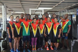 Members of the Guyana women and men’s hockey team posing at the Buddy’s Gym after inking a six-month deal to train at the facility for the upcoming Pan American Indoor Championship