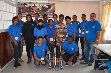 Team Guyana posing with their robot entry for the recent Washington DC robotics tournament 