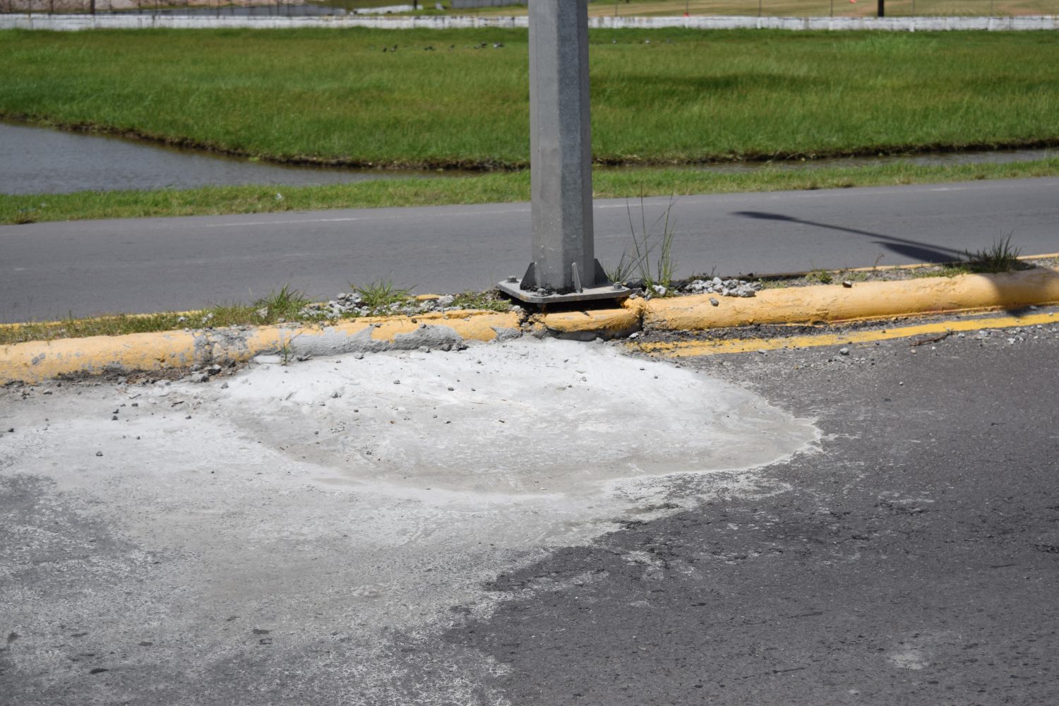 One of the potholes along Carifesta Avenue which was recently filled with concrete. (MPI photo)