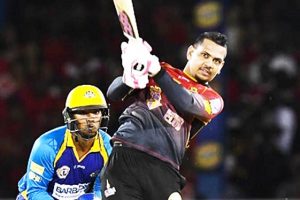 PORT OF SPAIN, TRINIDAD - AUGUST 12: In this handout image provided by CPL T20, Sunil Narine (R) of Trinbago Knight Riders hits 6 during Match 11 of the 2017 Hero Caribbean Premier League between Barbados Tridents and Trinbago Knight Riders at Queen's Park Oval on August 12, 2017 in Port of Spain, Trinidad. The keeper is Nicholas Pooran (L) of Barbados Tridents.
(Photo by Randy Brooks - CPL T20 via Getty Images)