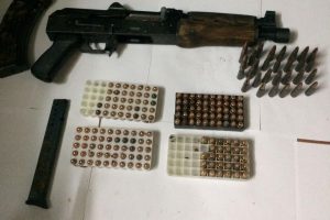 The AK-47 assault rifle, the magazine and the ammo that were found (Guyana Police Force photo)
