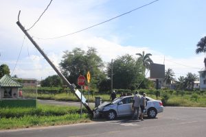 A series of mishaps: This motor car crashed into a utility post a few feet away from the junction of Hadfield Street and Vlissengen Road on Saturday. Stabroek News was told that the car grazed a bus and drove away but moments later crashed into a new motor car that was being delivered. After this, the driver lost control and ran into the pole.  