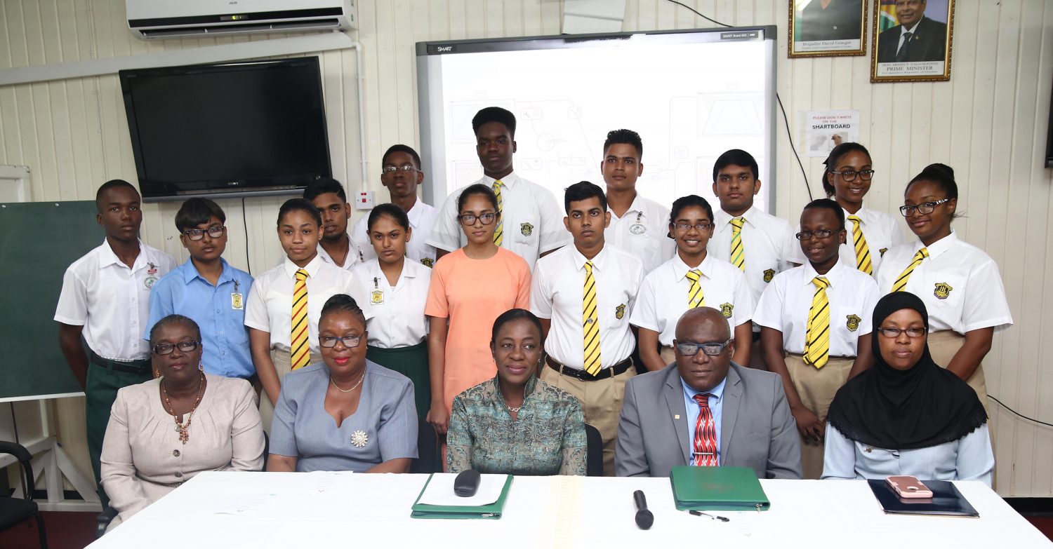 Top 15: Minister of Education Nicolette Henry (seated third from left), Chief Education Officer Marcel Hutson (fourth from left) and Head of the Examinations Division Sauda Kadir-Grant (seated right) along with 15 of this year’s top 16 CSEC Performers and other ministry officials. 
