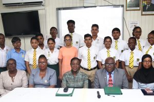 Top 15: Minister of Education Nicolette Henry (seated third from left), Chief Education Officer Marcel Hutson (fourth from left) and Head of the Examinations Division Sauda Kadir-Grant (seated right) along with 15 of this year’s top 16 CSEC Performers and other ministry officials.
