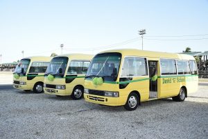 The three 35-seater buses, which will now serve the schoolchildren of north and south Georgetown. (Ministry of the Presidency photo)