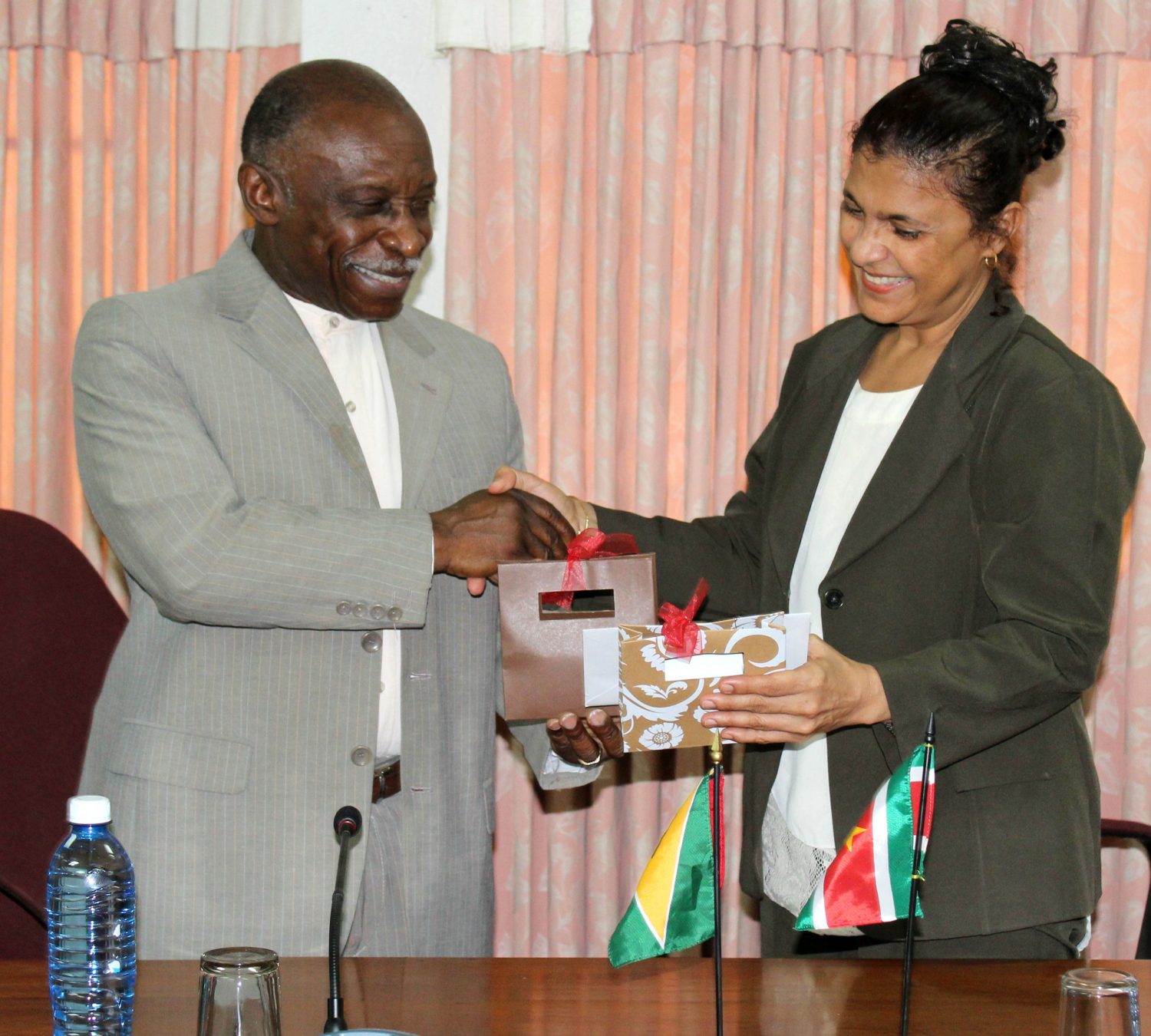Outgoing Surinamese Ambassador Mehroen Nisa Kurban-Baboe and Foreign Minister Carl Greenidge yesterday (Ministry of Foreign Affairs photo)
