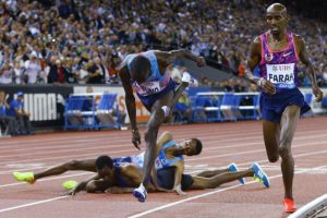 IAAF Diamond League, Zurich, Switzerland. Mo Farah of Britain competes with American Paul Chelimo while Ethiopians Yomif Kejelcha and Muktar Edris  fall on the track in the 5,000 metres (Arnd Wiegmann)