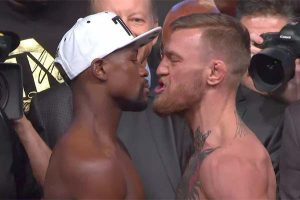 Floyd Mayweather, left and Conor Mc Gregor at yesterday’s weigh in where Mc Gregor (153)  came in at three and one half pounds more than Mayweather (149.5).
