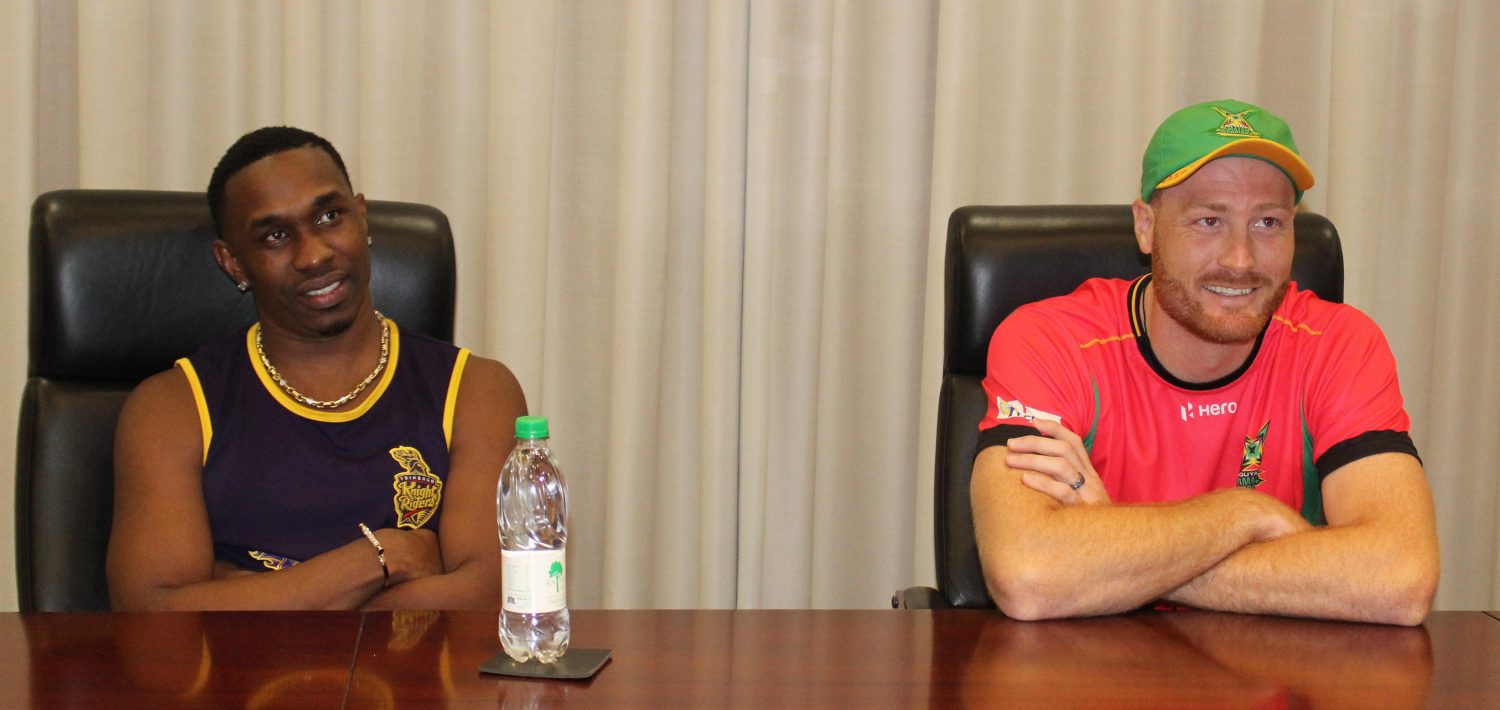 Knightriders’ skipper Dwayne Bravo and Warriors’ captain Martin Guptill in a relaxed mood at the prematch press conference yesterday at the Guyana Marriott (Royston Alkins photo) 

