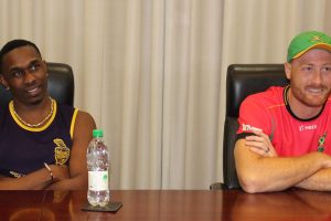 Knightriders’ skipper Dwayne Bravo and Warriors’ captain Martin Guptill in a relaxed mood at the prematch press conference yesterday at the Guyana Marriott (Royston Alkins photo) 
