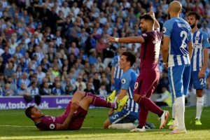 Brighton’s Lewis Dunk looks dejected after scoring an own goal and the second for Manchester City as Manchester City’s Gabriel Jesus and Sergio Aguero celebrate (Hannah McKay)
