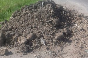 The pile of mud that the motorcycle reportedly collided with. It is one of many along the Cummings Lodge access road and which take over a significant portion of the roadway.