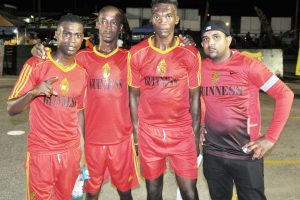 Richie Ramdeholl (right), Manager of Dave and Celina’s All-Stars with members of the team (left to right) Kenard Simon, Rawle Gittens and Keon Sears, after their recent triumph in the Guinness ‘Greatest of the Streets’ National Championship
