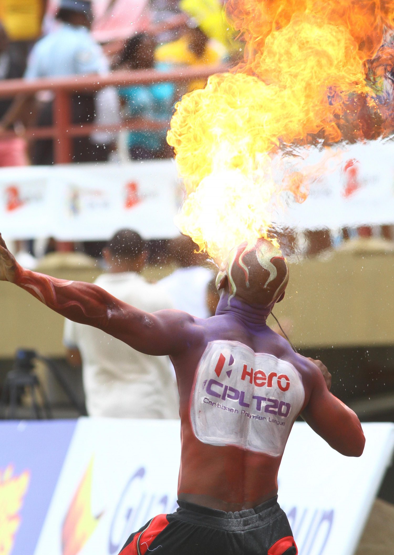 A fire eater entertains the crowd at yesterday’s CPL encounter between the Amazon Warriors and the Trinbago Knightriders  at the National Stadium, Providence (Orlando Charles photo)