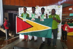 The Guyana Karate Federation team at the 3rd Caribbean Karate Championships in Suriname, from left to right, Shakeem Walcott, Trevon Miller, Shemar Parkinson and Keith Beaton.
