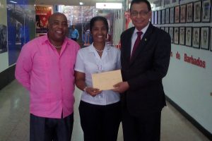 FlyJamaica/Air Guyana Representative resident in Havana Lindbergh Smith (left) and Guyana’s Ambassador to Cuba Halim Majeed (right) receiving the approval from a Manager of the Cuban Civil Aviation Authority on Monday, July 24, 2017