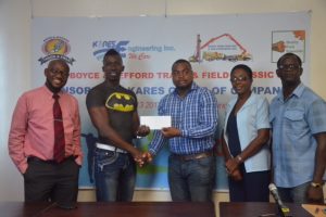 Co-founder, Edison Jefford (centre) collects the sponsorship pact from Kares Engineering Inc’s Brand Ambassador, Paul Meusa as Kares Engineering representatives and Colin Boyce (right) look on 