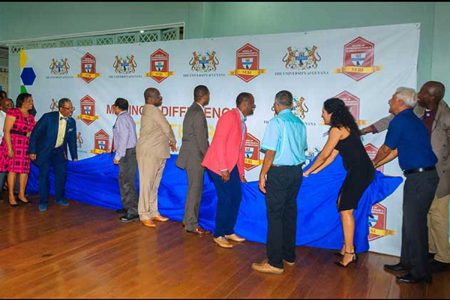 Stakeholders unveiling banner at the launch of University of Guyana School of Entrepreneurship and Business Innovation 