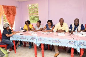 Permanent Secretaries of the Ministry of Indigenous Peoples’ Affairs, Alfred King (second from right) and Ministry of Education Vibert Welch (right) and other members of the team during the meeting with the Baramita Village Council. (Ministry of the Presidency photo)