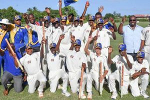 The champion Barbados Under-15 squad celebrate their triumph.
