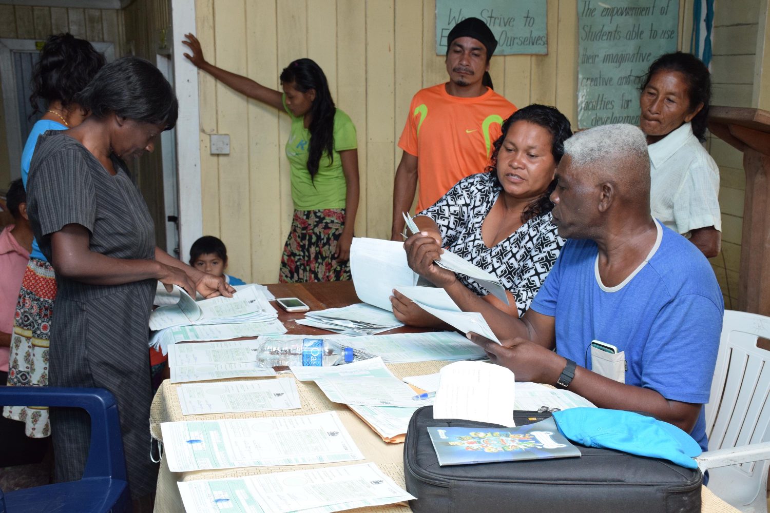 Residents of Baramita collecting their birth certificates (DPI photo)