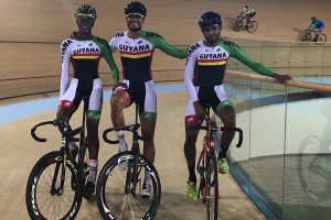 Guyana’s three representatives at the ongoing Pan American Track Cycling Champ-ionships in Couva, Trinidad and Tobago, pose for a photo following a practice session on Tuesday. From left is Romello Crawford and the USA based duo of Scott Savory and Darryl Rogers.
