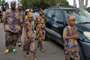 A family in
traditional
African wear,
taking a stroll through the National Park at the Emancipation Day Celebrations  yesterday