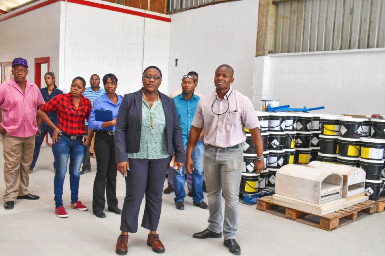 Minister Simona Broomes and Country Director of MS Analytical Rory Forde (right) touring the facility (DPI photo)