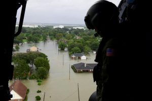 A Coast Guard helicopter searches areas hit by floodwaters caused by tropical storm Harvey in Beaumont, Texas. (U.S. Coast Guard/Petty Officer 3rd Class Brandon Giles/Handout/Reuters)