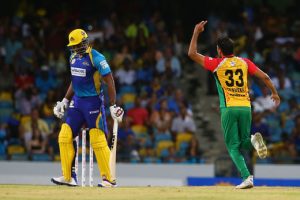 Kieron Pollard (L) captain of Barbados Tridents is dismissed for  a duck  as Sohail Tanvir (R) of the Guyana Amazon Warriors celebrates during Match 25 of the 2017 Hero Caribbean Premier League between Barbados Tridents and  Guyana Amazon Warriors at the Kensington Oval Tuesday night. (Photo by Ashley Allen - CPL T20 via Getty Images)
